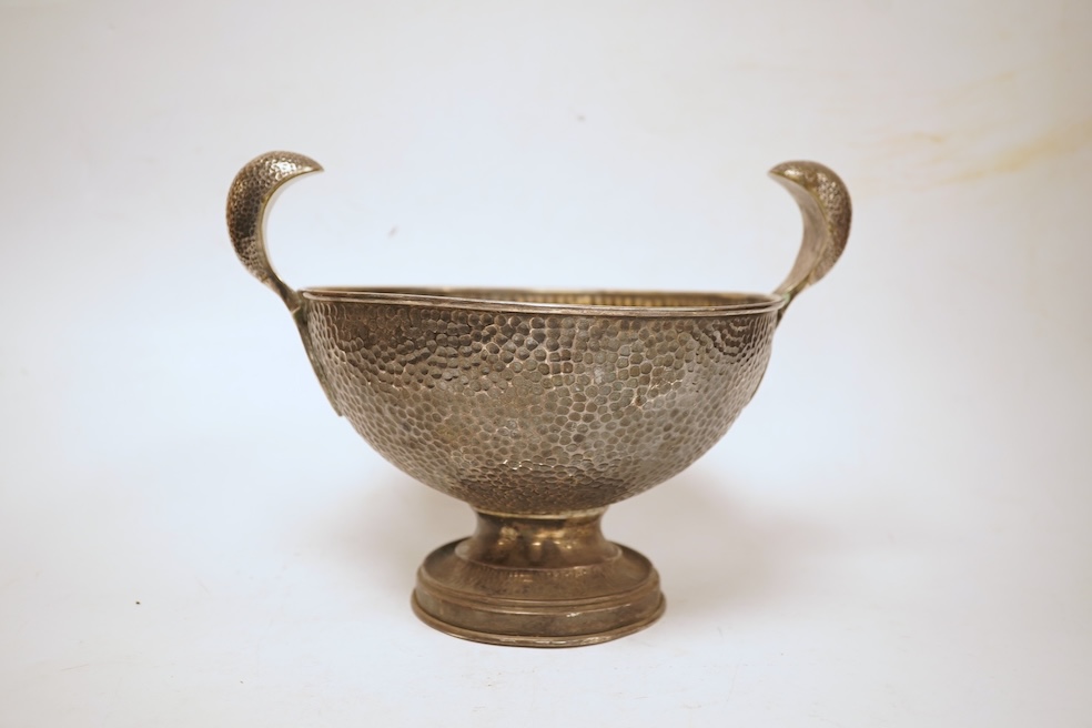 A hammered white metal two handled pedestal bowl, stamped 'Kennedy 925, diameter 18.9cm, 18.1oz.